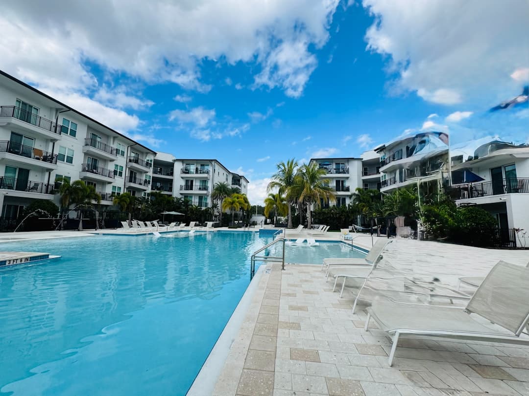 Modern resort with large swimming pool and lounge chairs