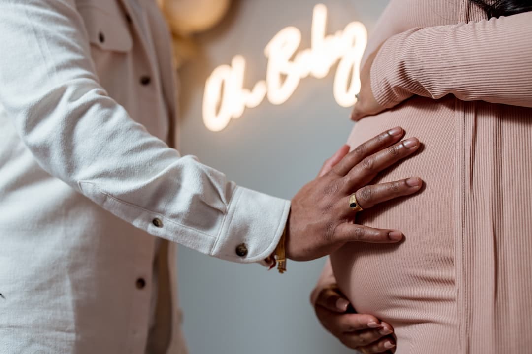 a pregnant woman's belly being examined by a doctor