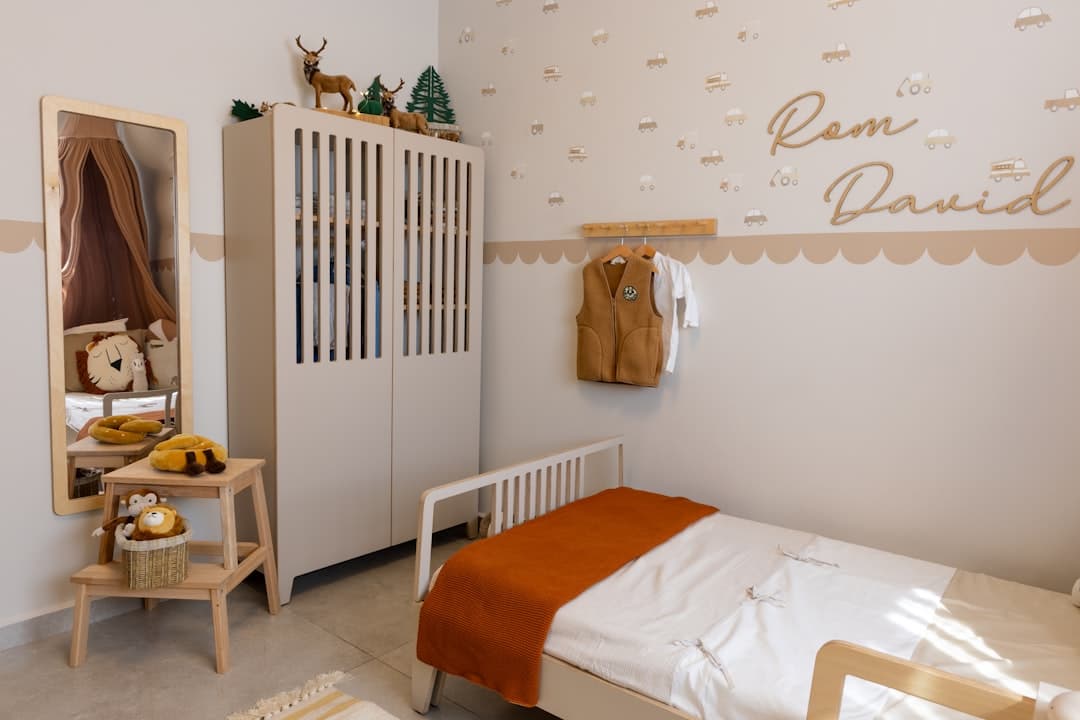 A cozy child's bedroom with a single bed.
